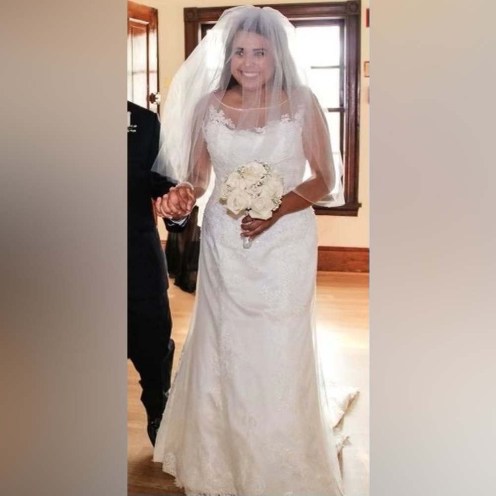 Elegant Ivory Wedding Gown. Intricate detailing!